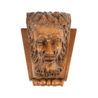 A mask head carving of a bearded