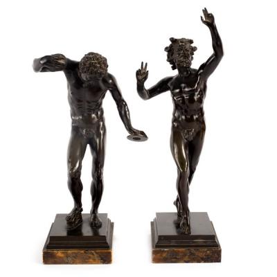 A matched pair of bronze figures of