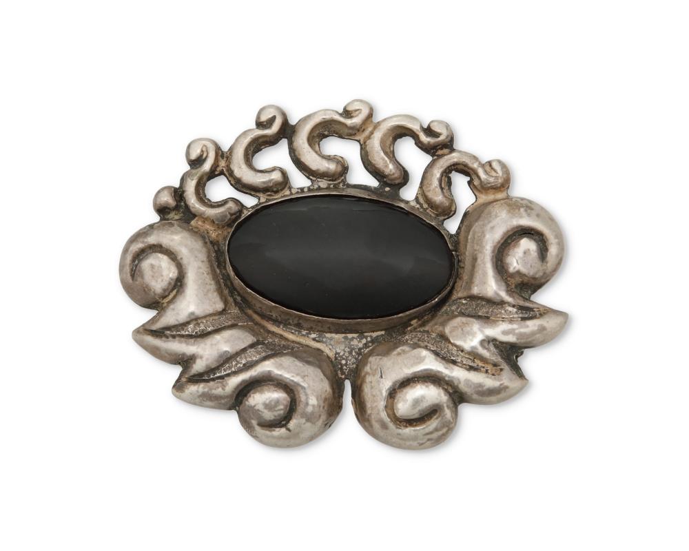 A MATL SILVER AND ONYX BROOCHA Matl