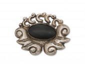 A MATL SILVER AND ONYX BROOCHA