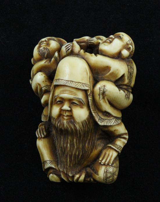 A Meiji period ivory netsuke carved