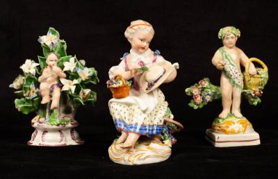 A Meissen figure of a seated girl