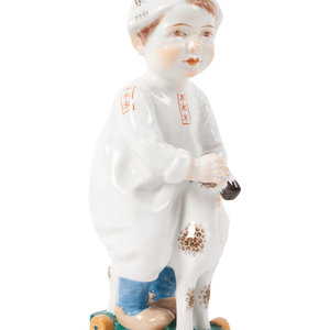 A Meissen Porcelain Figure of a Boy