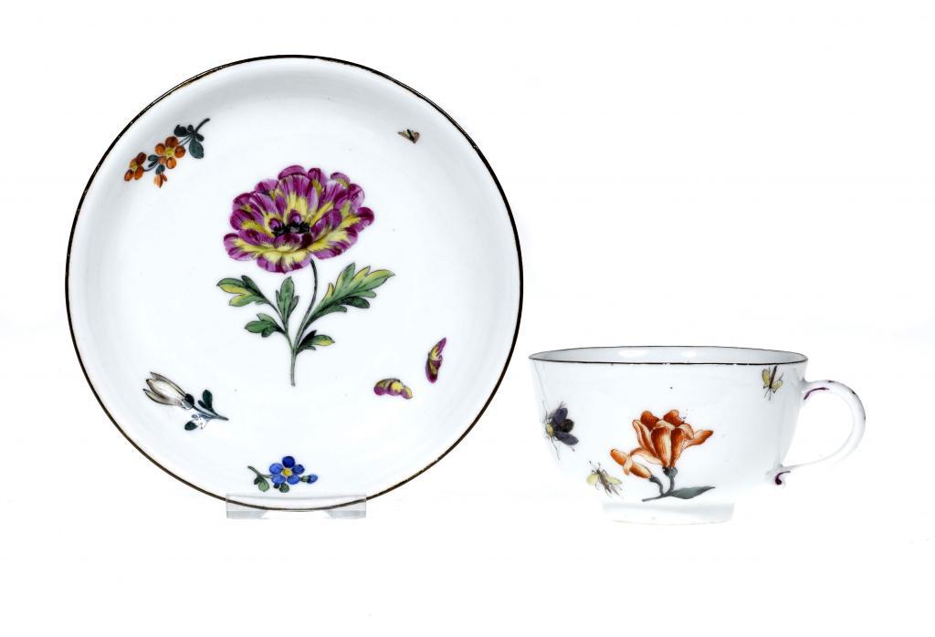 A MEISSEN TEACUP AND A SAUCER the