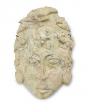 A MESOAMERICAN-STYLE STONE MAS