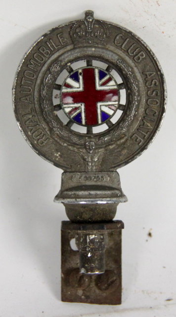 A metal car badge Royal