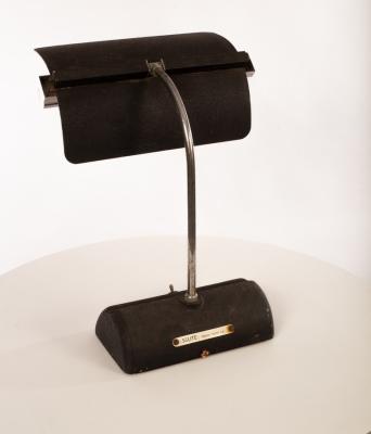 A metal desk lamp, the textured