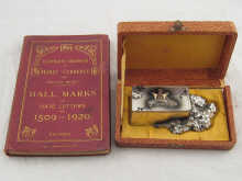 A metal Japanese double ink well in