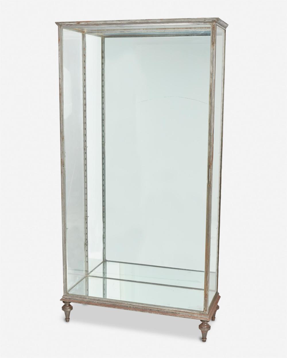 A METAL MOUNTED GLASS VITRINEA
