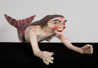 A Mexican Polychromed Figure of a