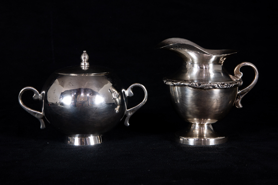 A MEXICAN STERLING CREAMER AND AN