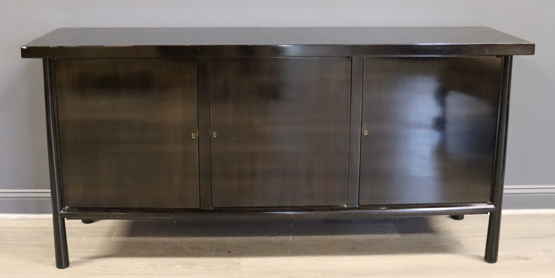 A MIDCENTURY EBONISED ROBESJOHN