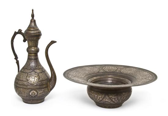 A Middle Eastern Silver Inlaid Ewer