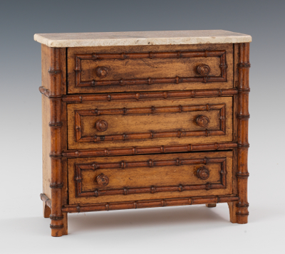 A Miniature Chest of Drawers with