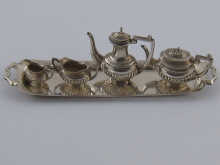 A miniature silver four piece tea