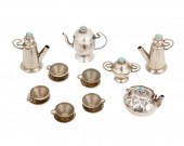 A MINIATURE SILVER TEA SETA So
