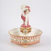 A Minton pierced footed figura