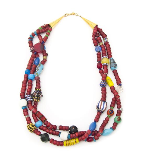 A Mixed Trade Three Strand Necklace