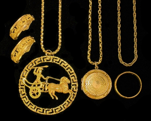 A modern 14k gold medallion with