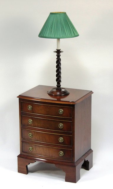 A modern bowfront miniature chest