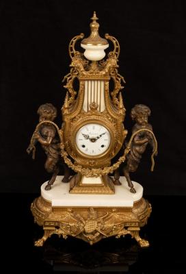 A modern gilt metal cased mantel