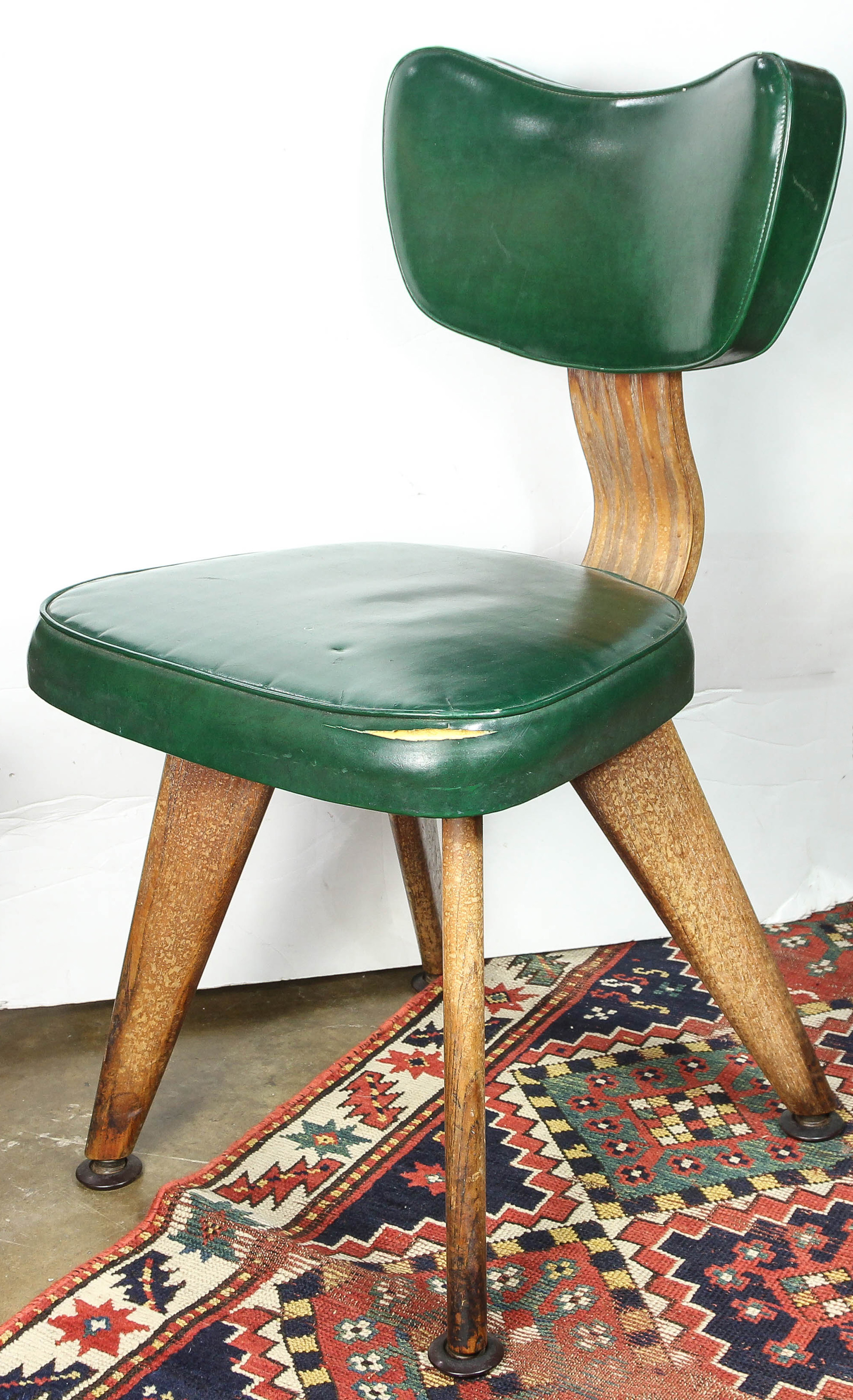 A MODERN GREEN VINYL SIDE CHAIR A