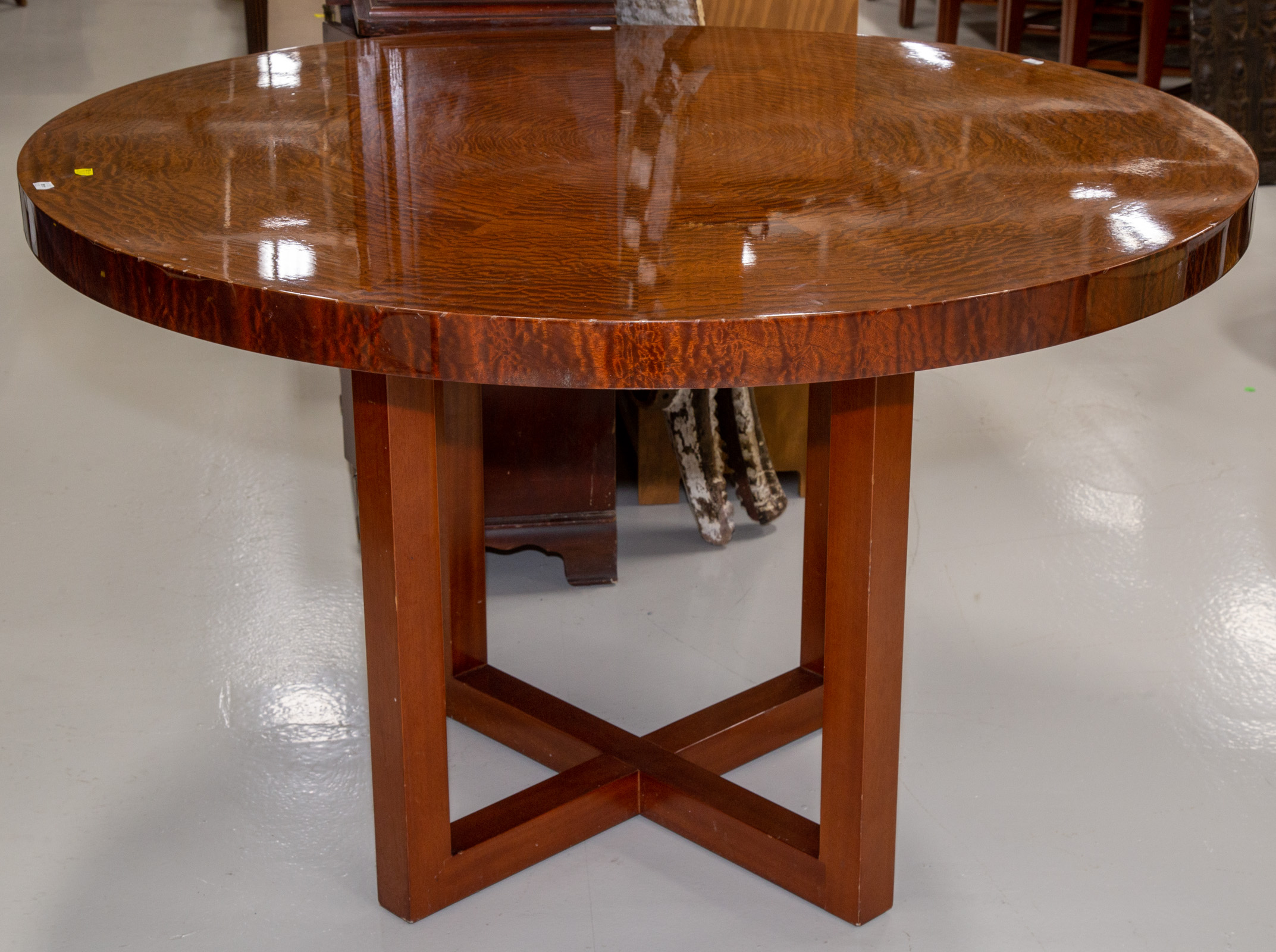 A MODERN ROUND MAHOGANY CENTER