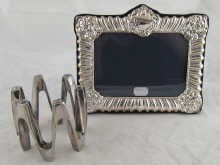 A modern silver photo frame 19 x