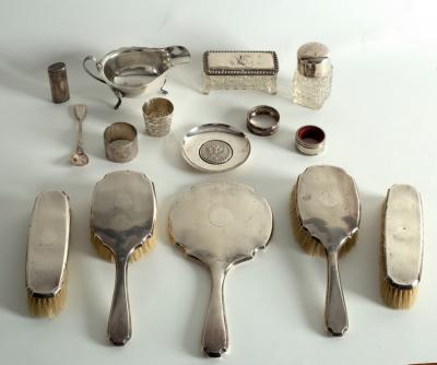 A modern silver sauceboat, and