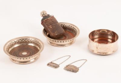 A modern silver wine coaster,