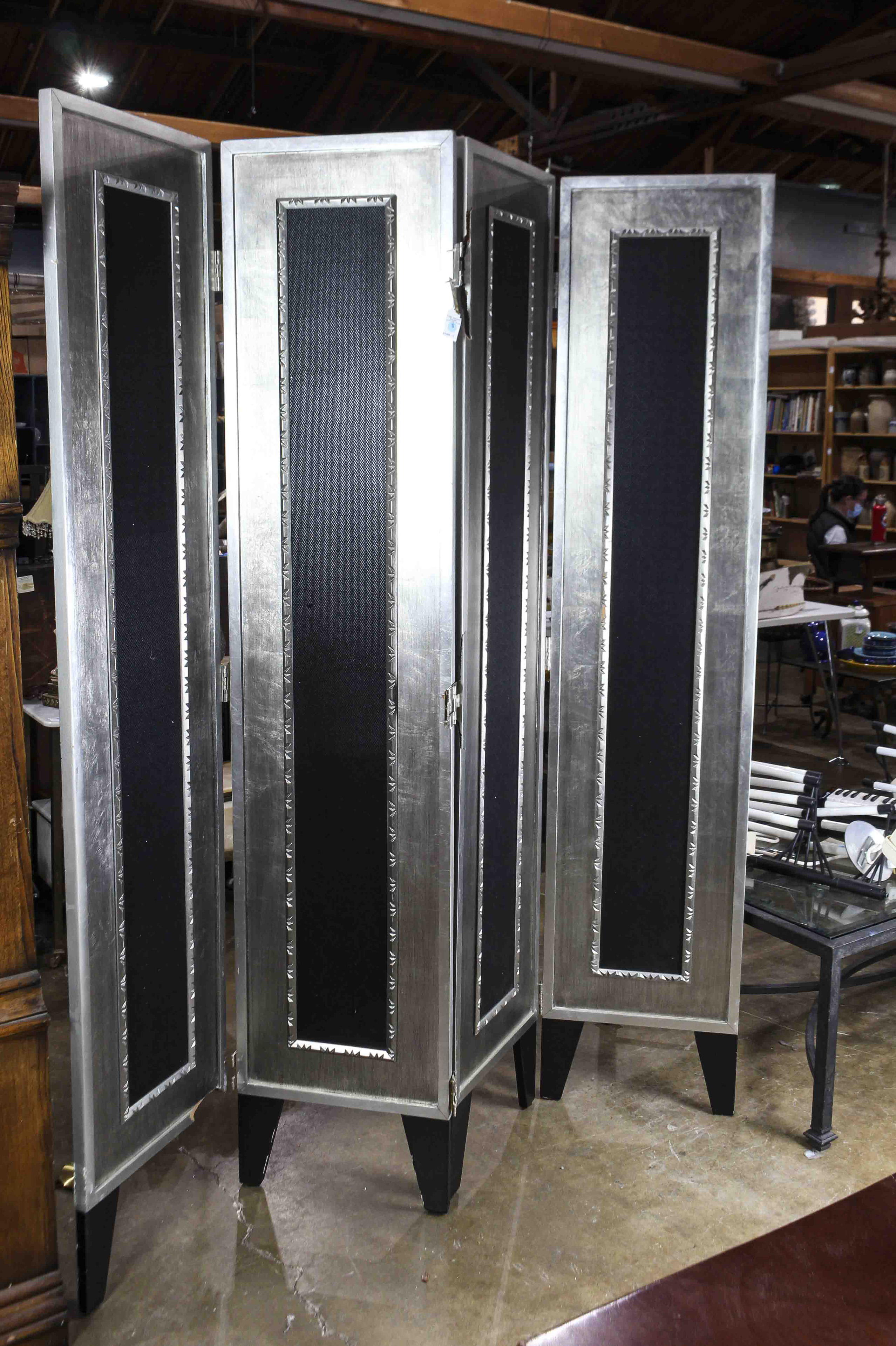 A MODERN SILVERED AND EBONIZED FOUR
