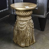 A MODERN TASSEL FORM TABOURET
