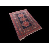 A MOGHAN KAZAK POLYCHROME RUG.