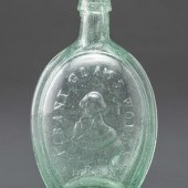 A Molded-Glass New York Flask