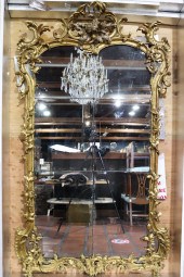 A MONUMENTAL  GILTWOOD CARVED