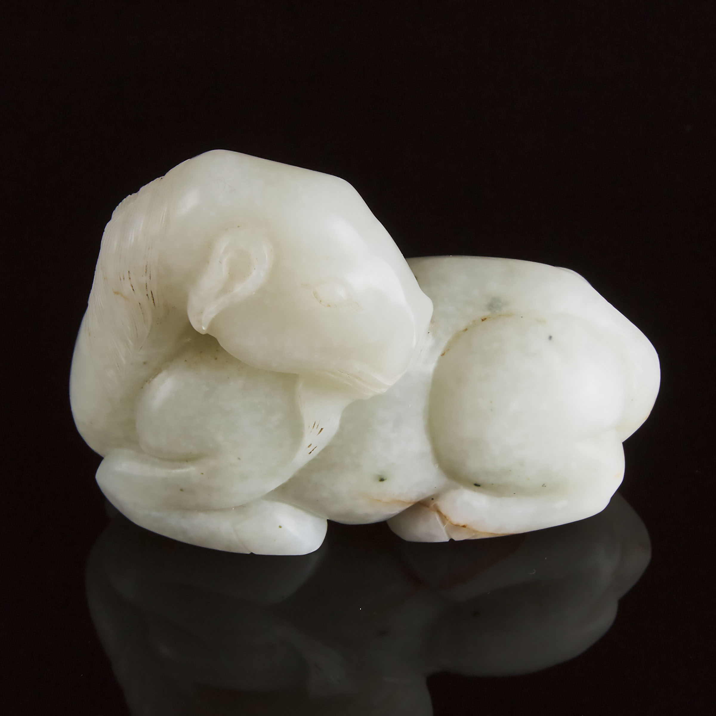 A Mottled White Jade Carving of a