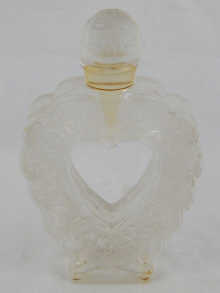 A mounted glass perfume bottle of