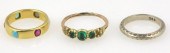 A multi gem set ring in an unh