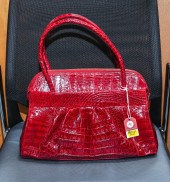 A NANCY GONZALEZ HANDBAG A red