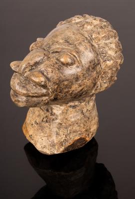 A native carved stone bust with