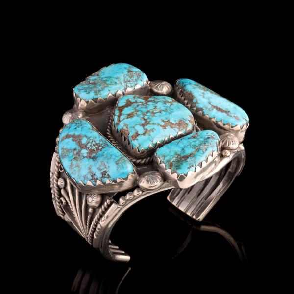 A NAVAJO BRACELET WITH FIVE MASSIVE