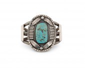 A NAVAJO CAST SILVER AND TURQU