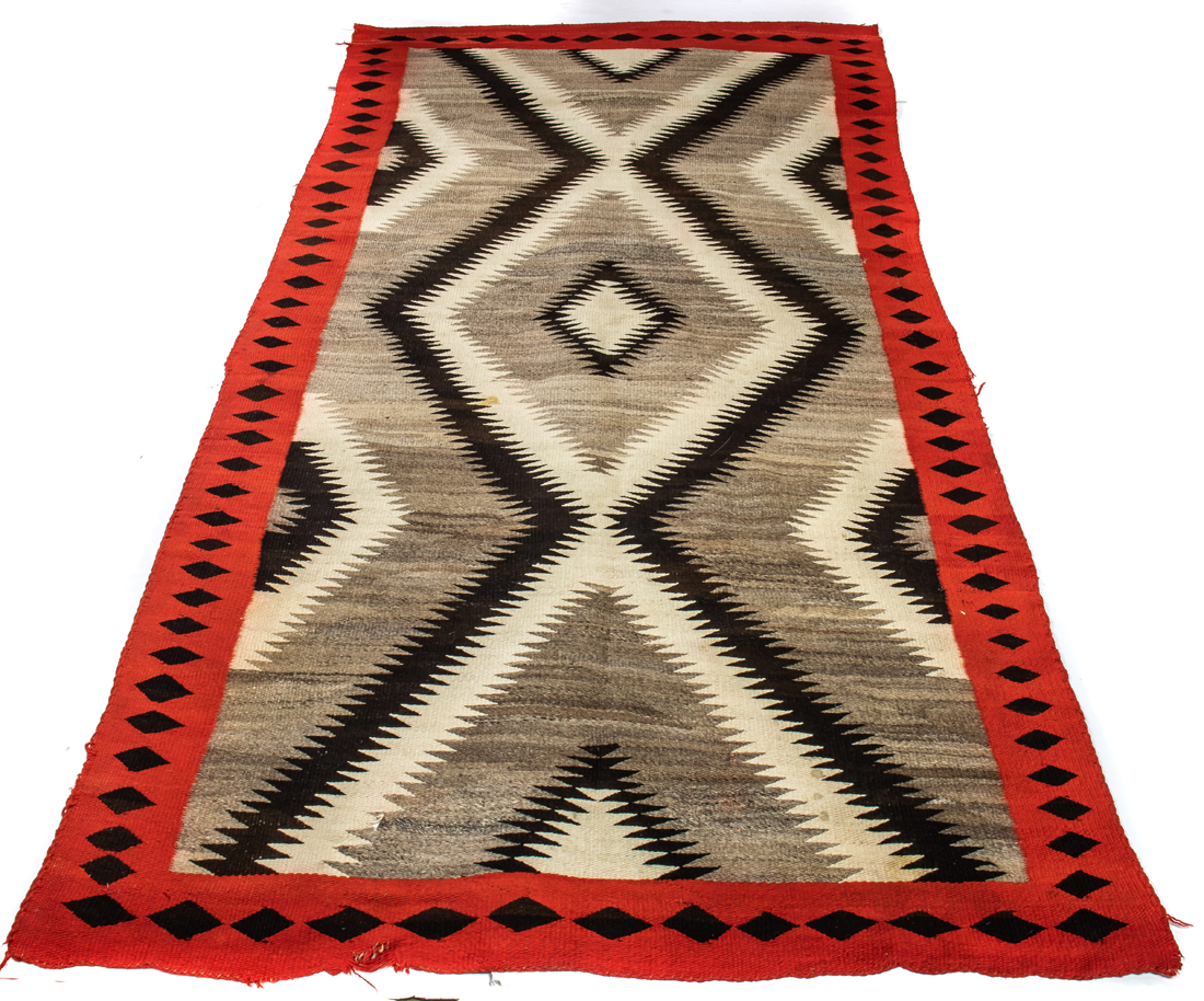 A NAVAJO EYE DAZZLER RUG A Navajo