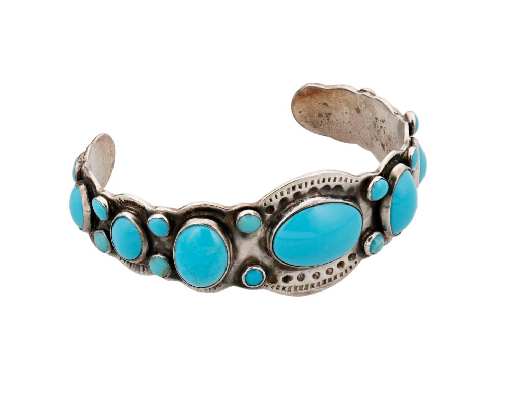 A NAVAJO INGOT SILVER AND TURQUOISE