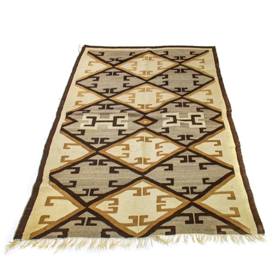 A NAVAJO RUG A Navajo rug, (cut