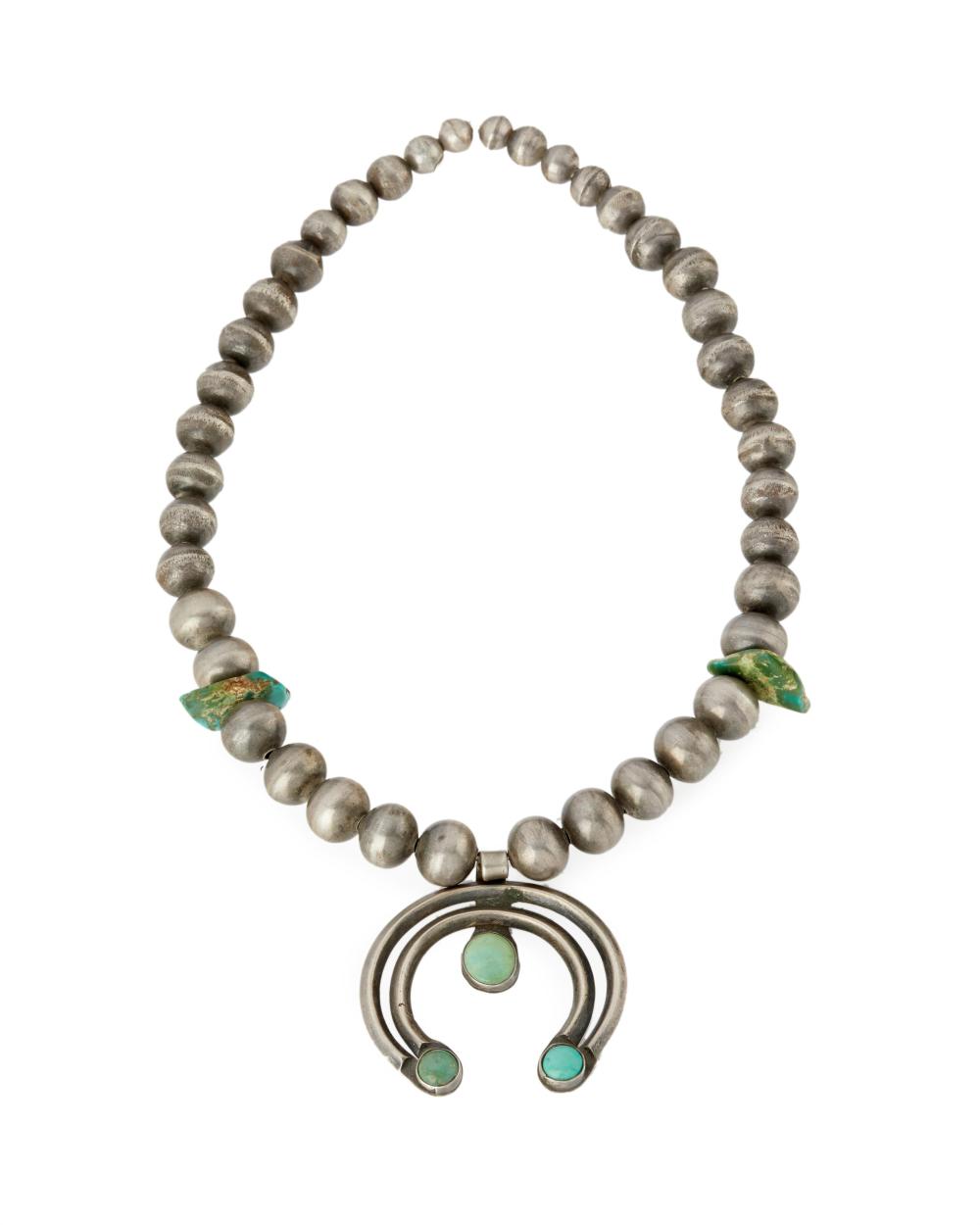 A NAVAJO SILVER AND TURQUOISE