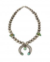 A NAVAJO SILVER AND TURQUOISE