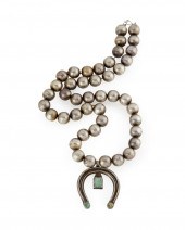 A NAVAJO SQUASH BLOSSOM NECKLA