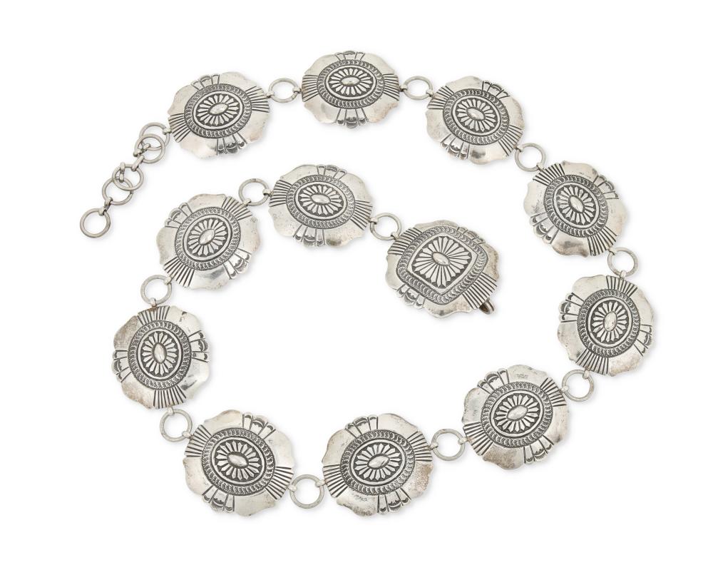 A NAVAJO STERLING SILVER CONCHO