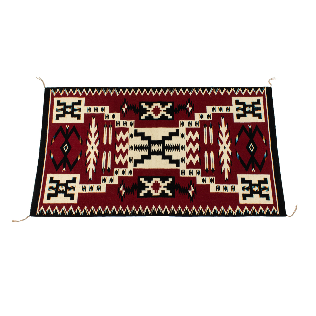 A NAVAJO STORM PATTERN RUG, 63 A